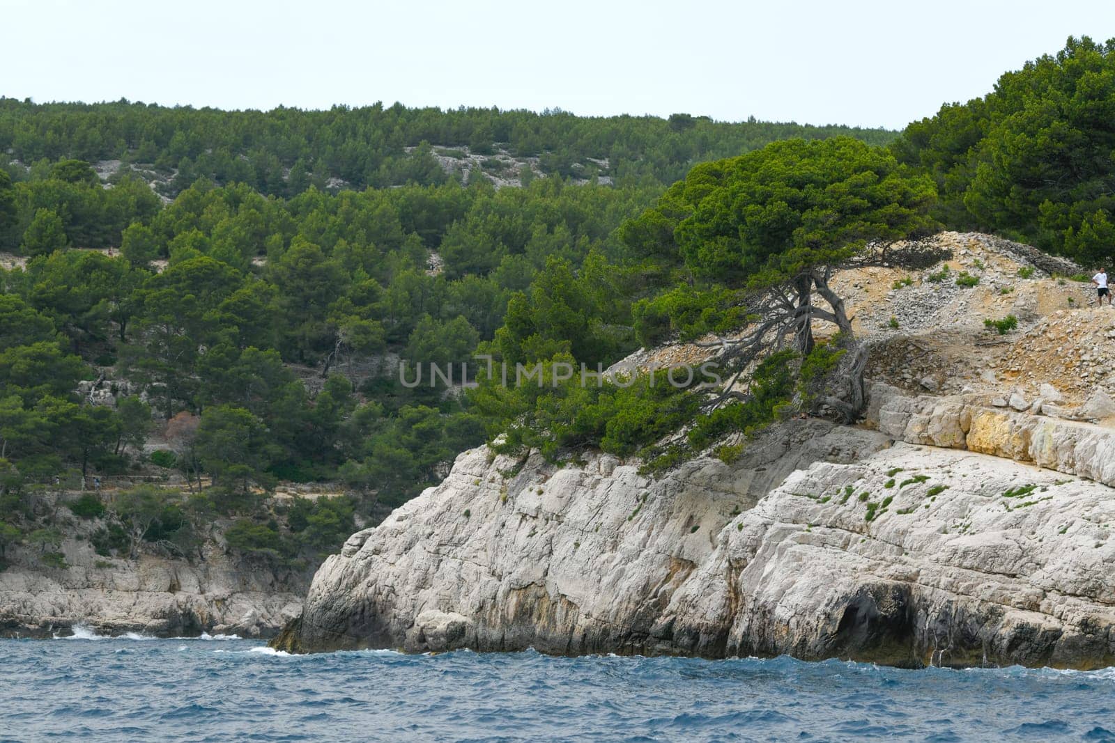 Marseille, France - June 9, 2024 : Calanque of Marseille on the Coast of Provence, Calanques National Park seen from an excursion boat cruising, High quality 4k footage