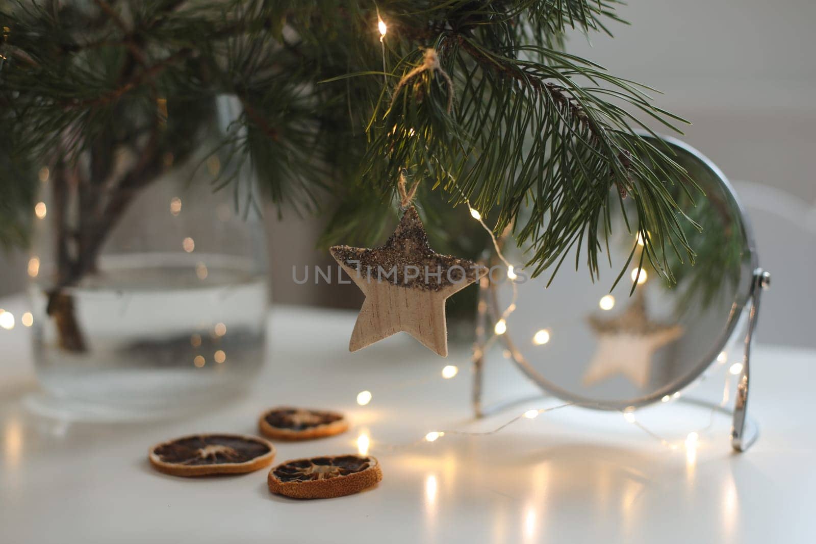 Christmas and New years eve Background. Close up of balls on christmas tree. Bokeh garlands in the background. New Year concept. Decorated Christmas tree on blurred, sparkling and fairy background