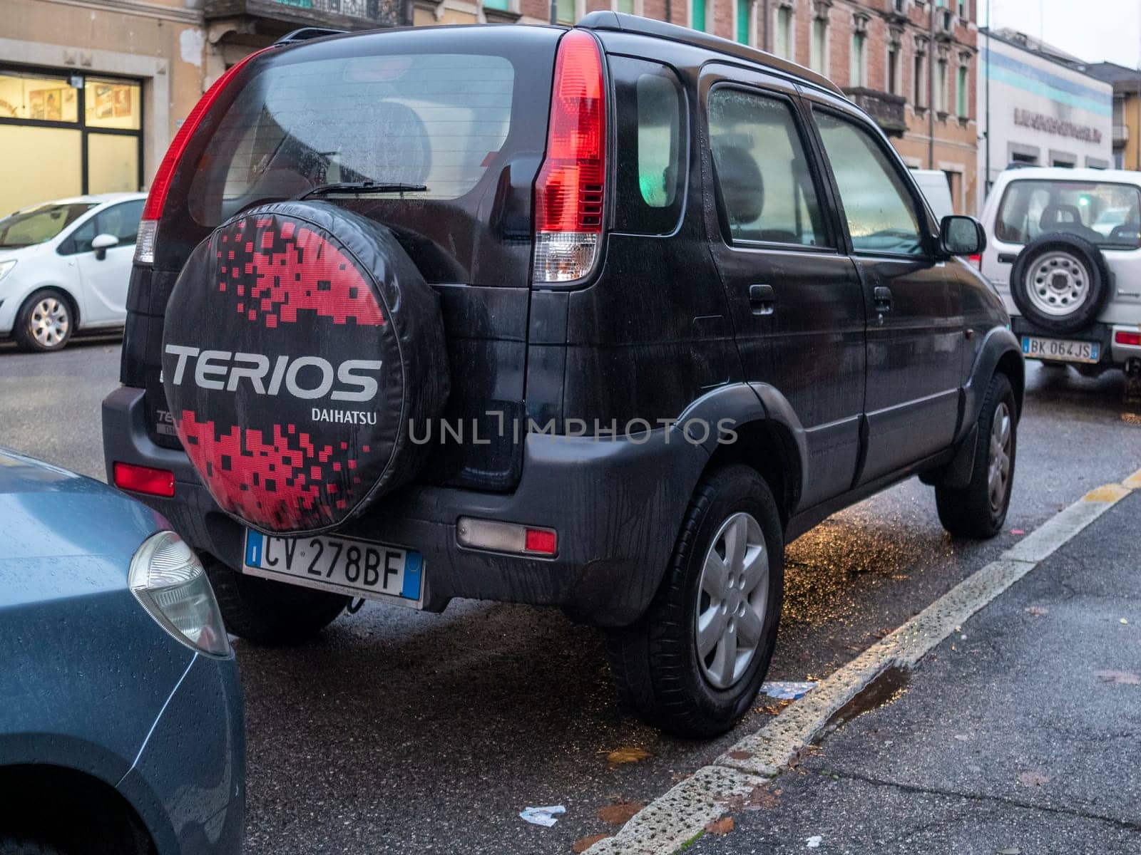 Cremona, Lombardy, Italy October 15th 2024 Rear view of a black daihatsu terios suv parked on a city street, showcasing its spare wheel cover