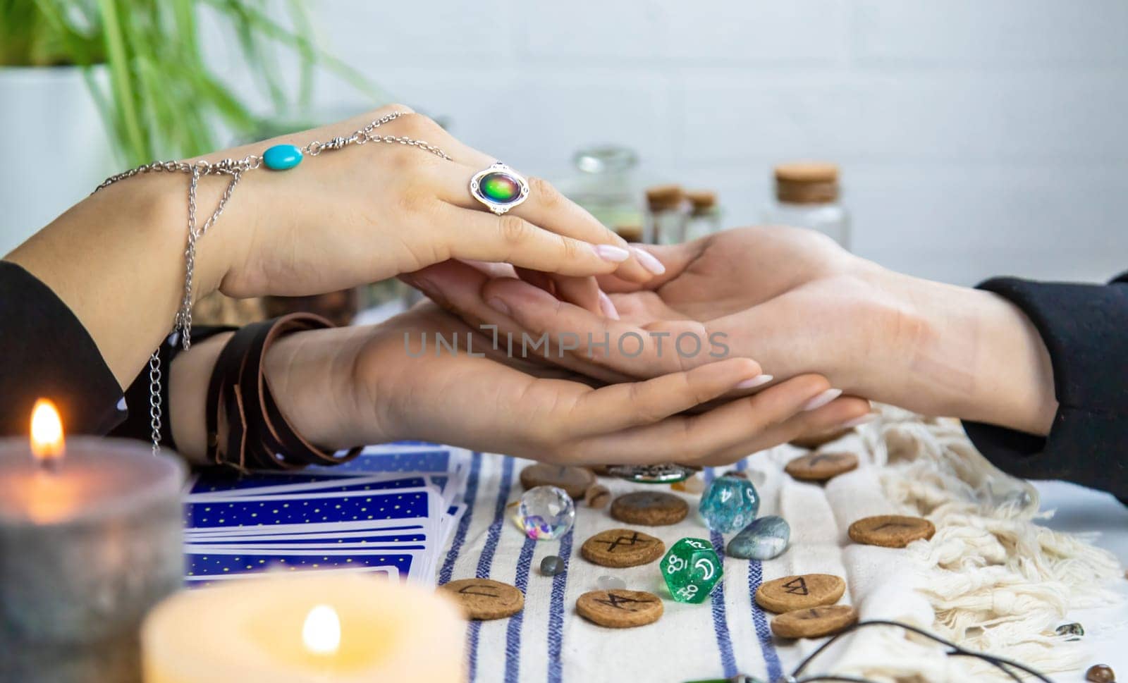 A fortune teller reads with tarot cards. Selective focus. Woman.