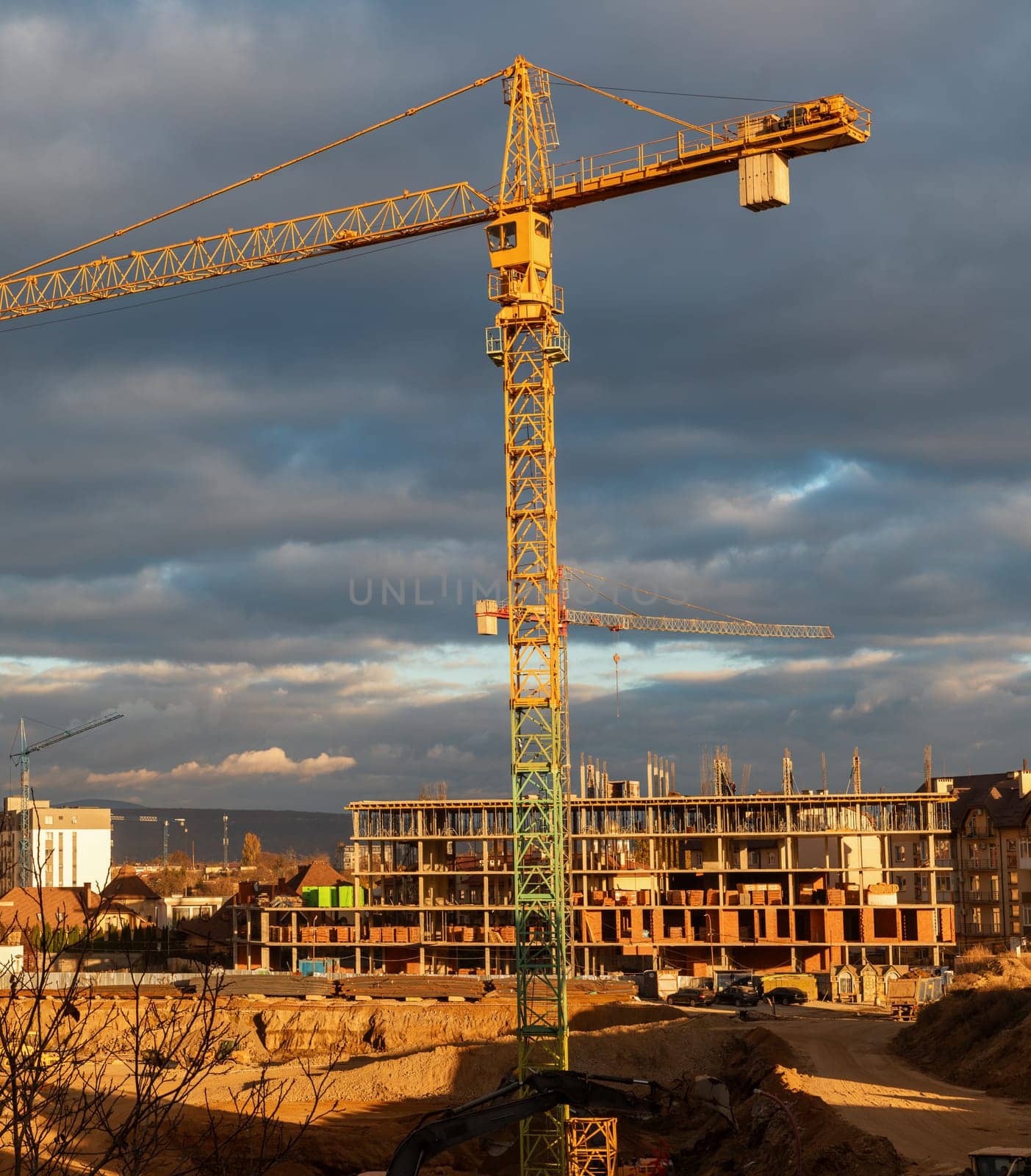 Construction boom in western Ukraine. An urban landscape showing cranes and buildings at various construction stages.