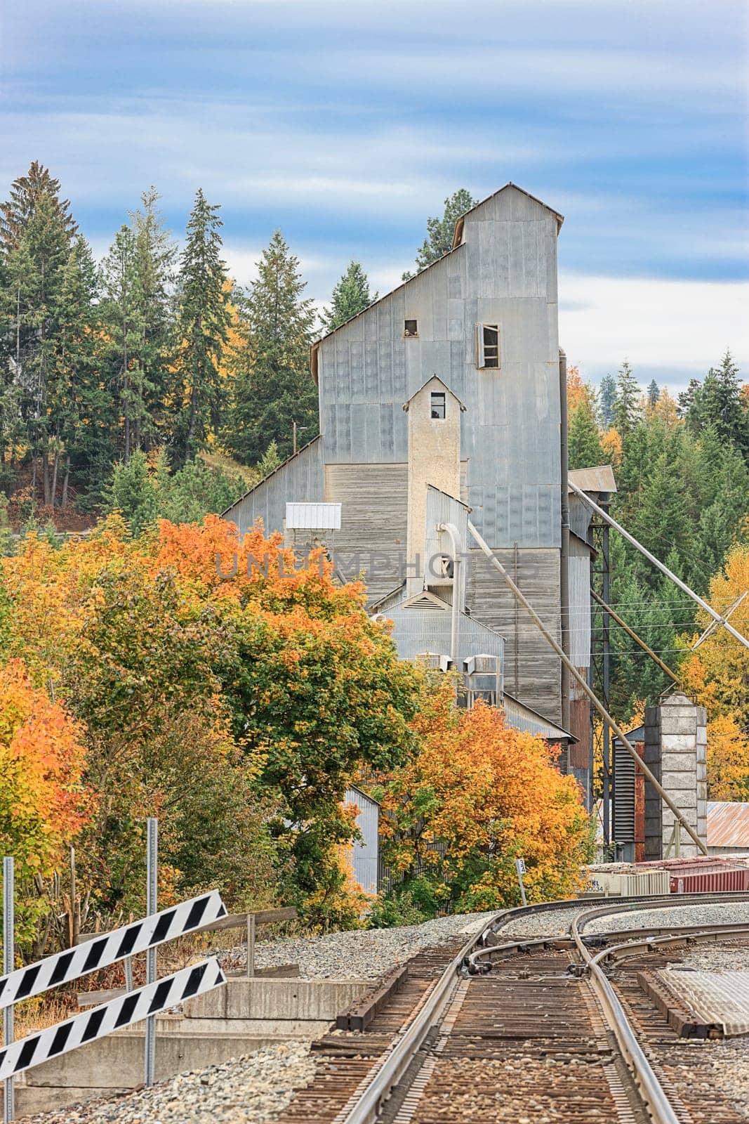 Railroad tracks lead to a vintage industrial building in Bonners Ferry, Idaho.