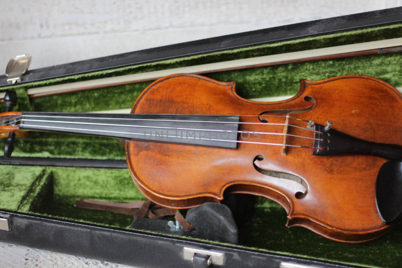 violin - an orchestral or solo professional bowed musical instrument with four strings. loved by children and adults. used in classical folk popular and jazz music. High quality photo