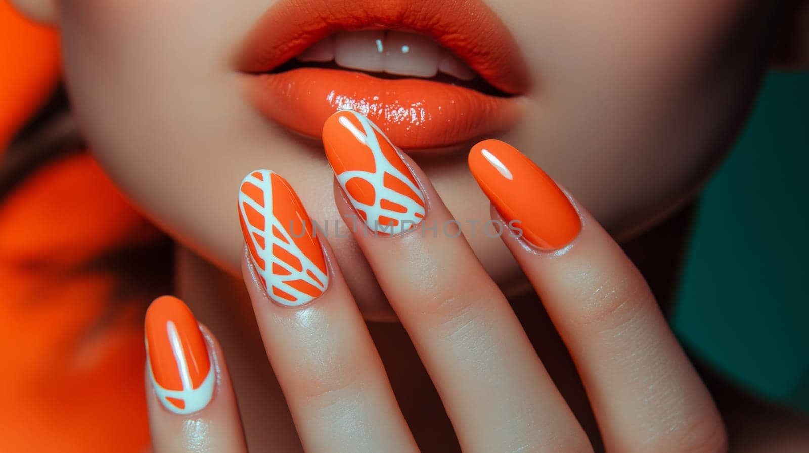 A close-up showcases a woman's hand adorned with vibrant orange and white nail art, complemented by matching orange lipstick. the image highlights modern beauty trends, featuring bold, colorful aesthetics and creative nail designs.