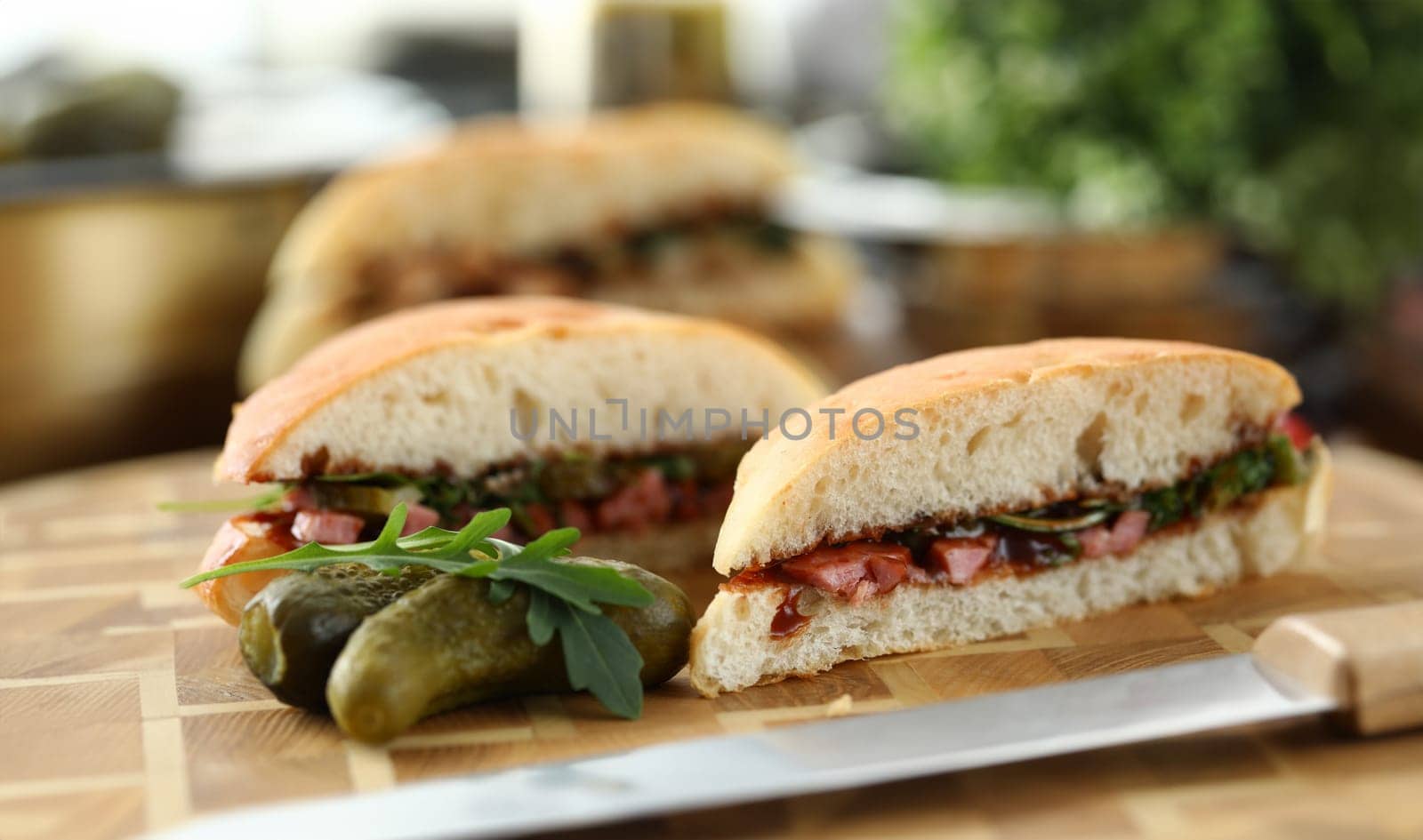 Close-up of delicious sandwiches with mixed stuffing. Fast food and calories. Unhealthy eating. Yummy brunch with fresh bread. Quick lunch and break from work concept