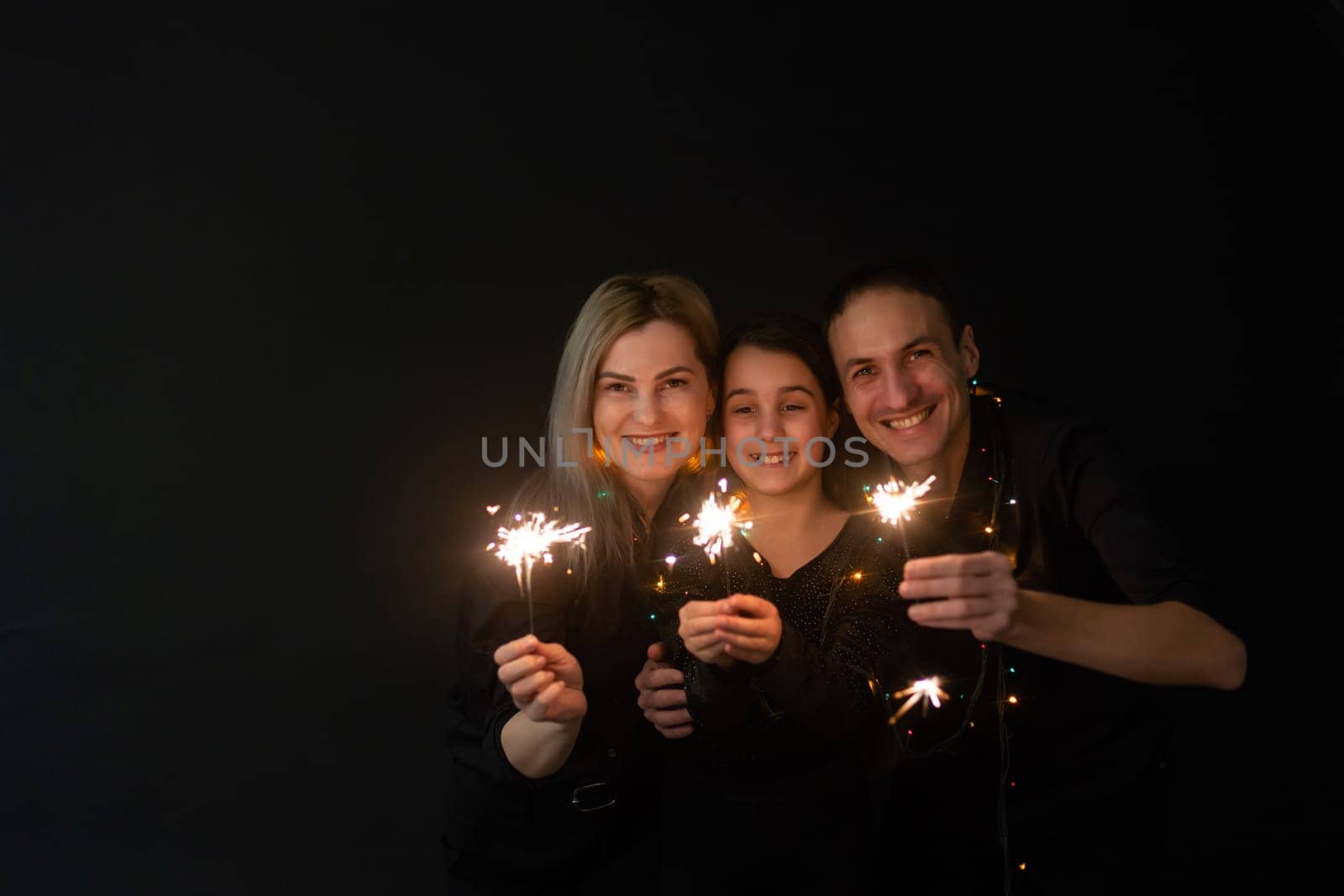 Family portrait on black background