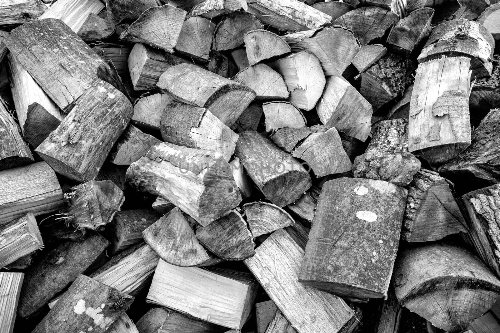 Pile of wood logs ready for winter. Wood logs texture background by EdVal