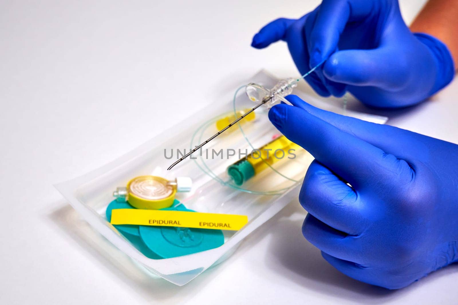 Ryazan, Russia - September 27, 2023: Needle for epidural anesthesia. Epidural anesthesia in medicine. Epidural anesthesia kit and doctor's hands in protective gloves close-up