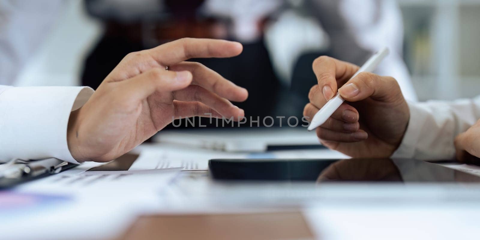 Woman hand holds stylus and puts an electronic signature in contract on tablet.