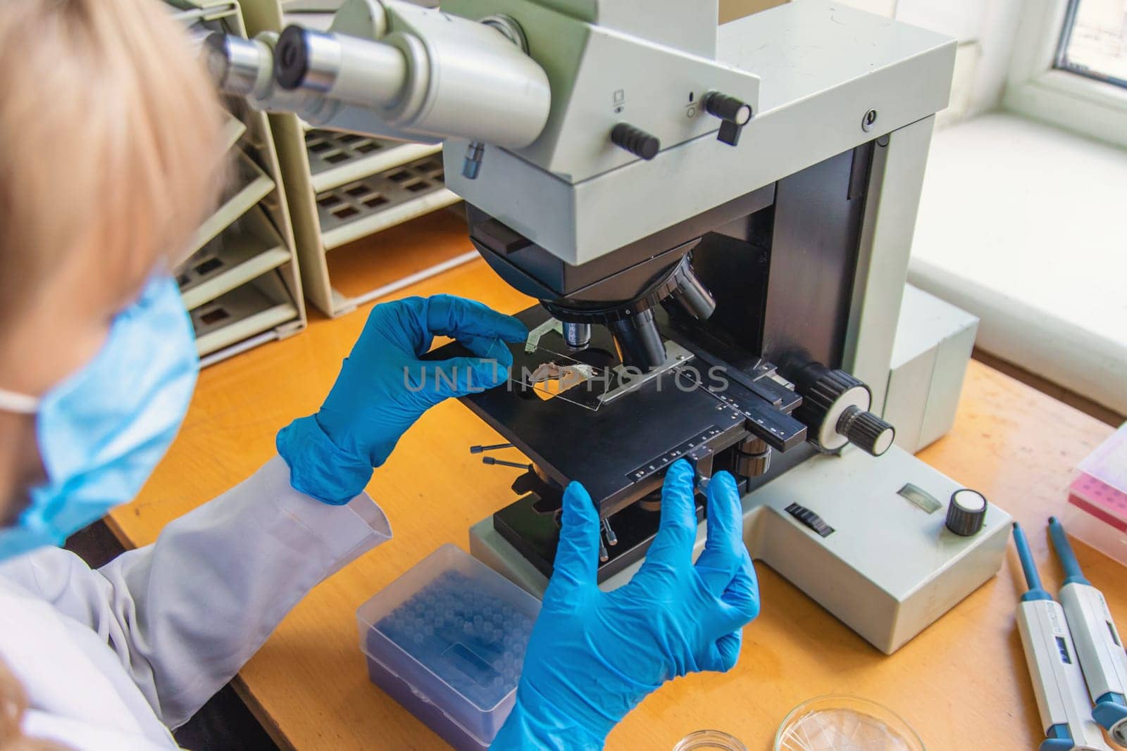 Examine in the laboratory under a microscope. Selective focus. medicine.