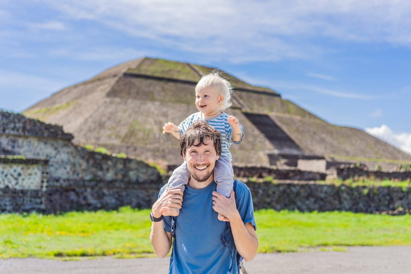 Father and son tourists exploring Teotihuacan, Mexico. Cultural heritage, ancient ruins, and archaeological adventure concept.
