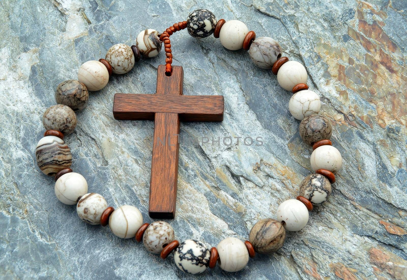 Rosary with wooden cross on stone background --ar 3:2 --quality 2 --v 6.1 Job ID: 3f05c3b4-5bf6-426a-8a5f-0040e99dd278