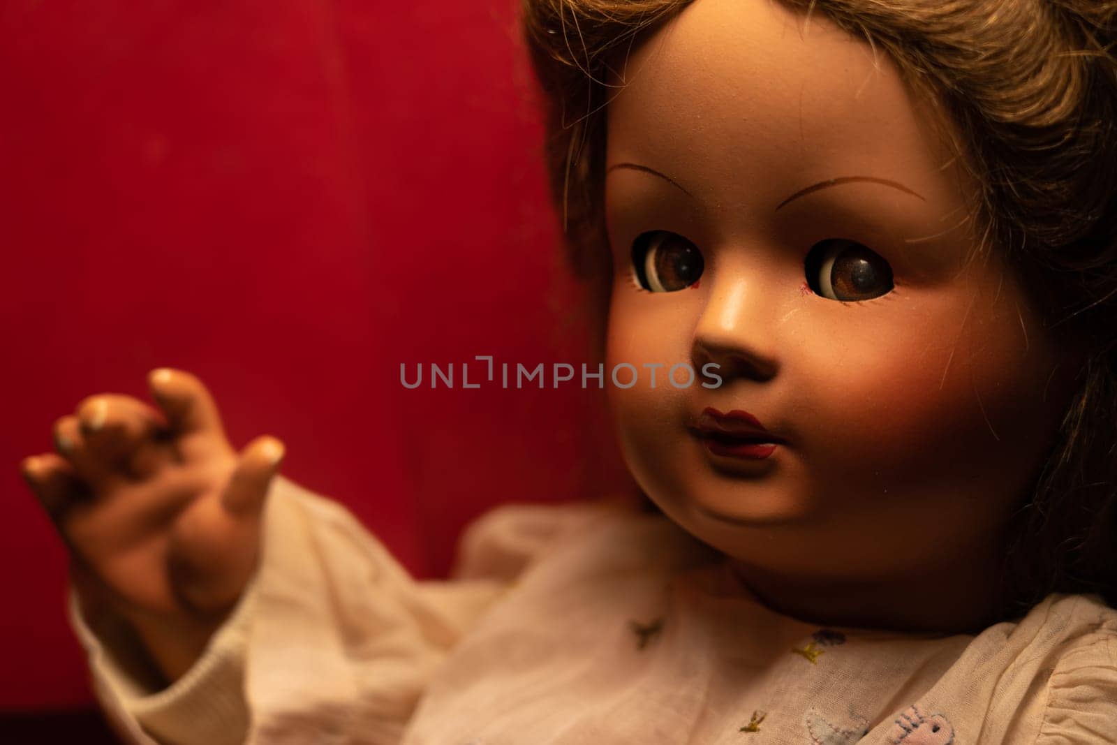 Scary vintage doll in half light. Close up