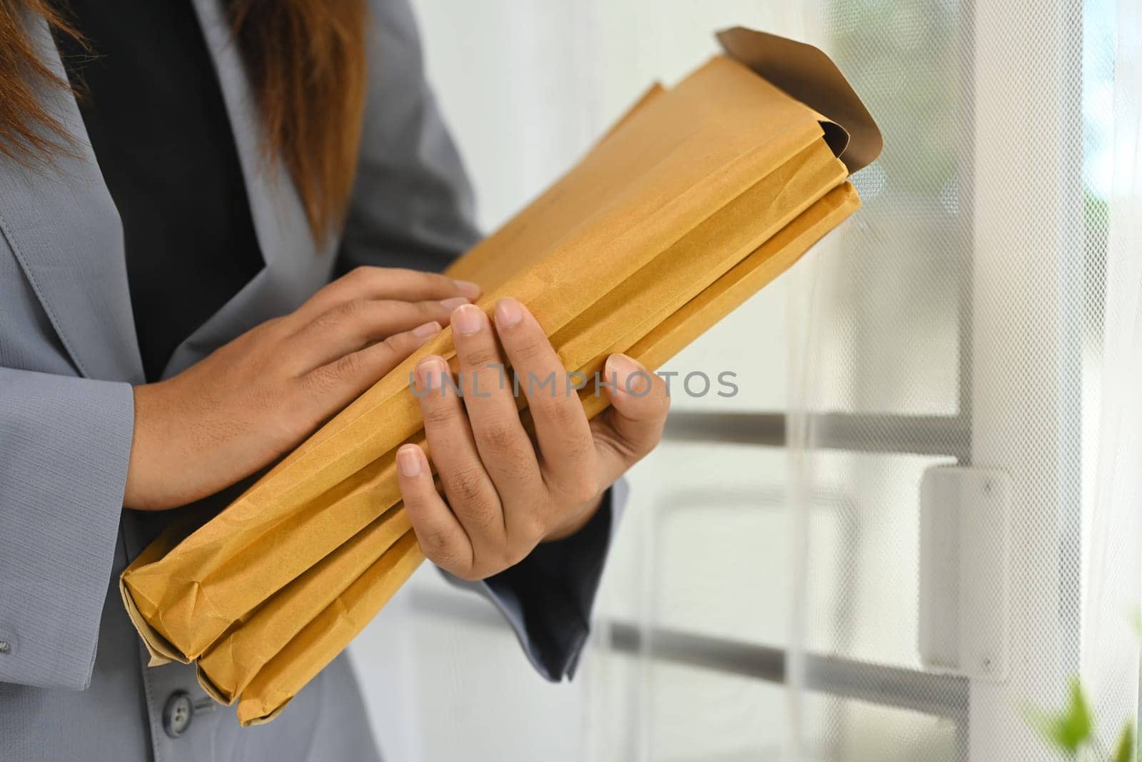 Cropped shot office worker managing document folders in office.