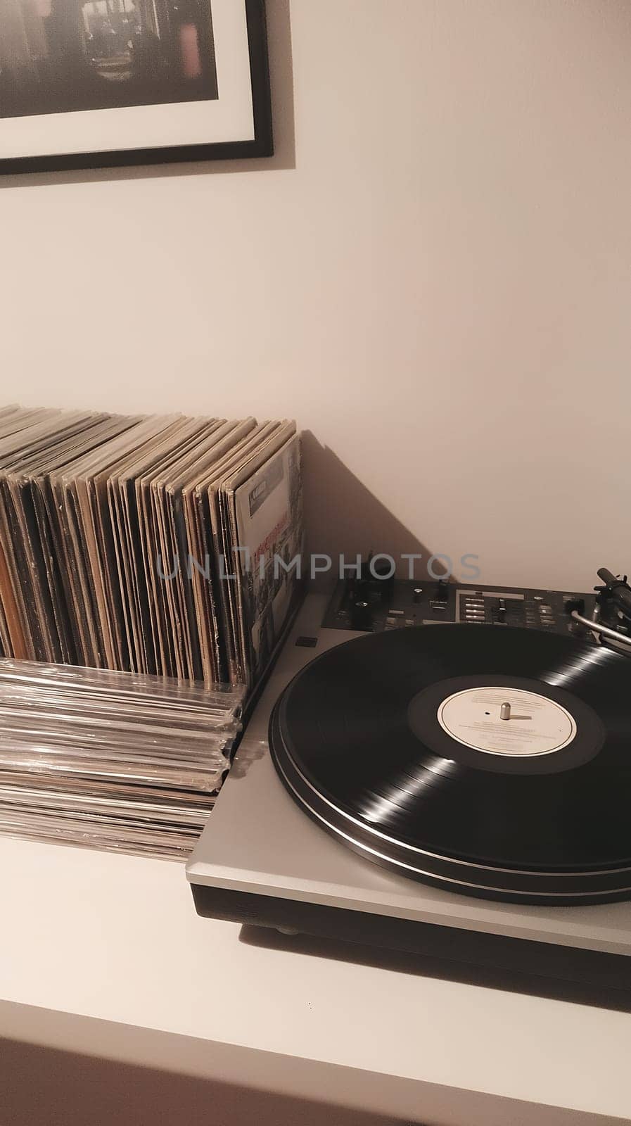 A vintage vinyl record player with a collection of albums, perfect for music enthusiasts and audiophiles.