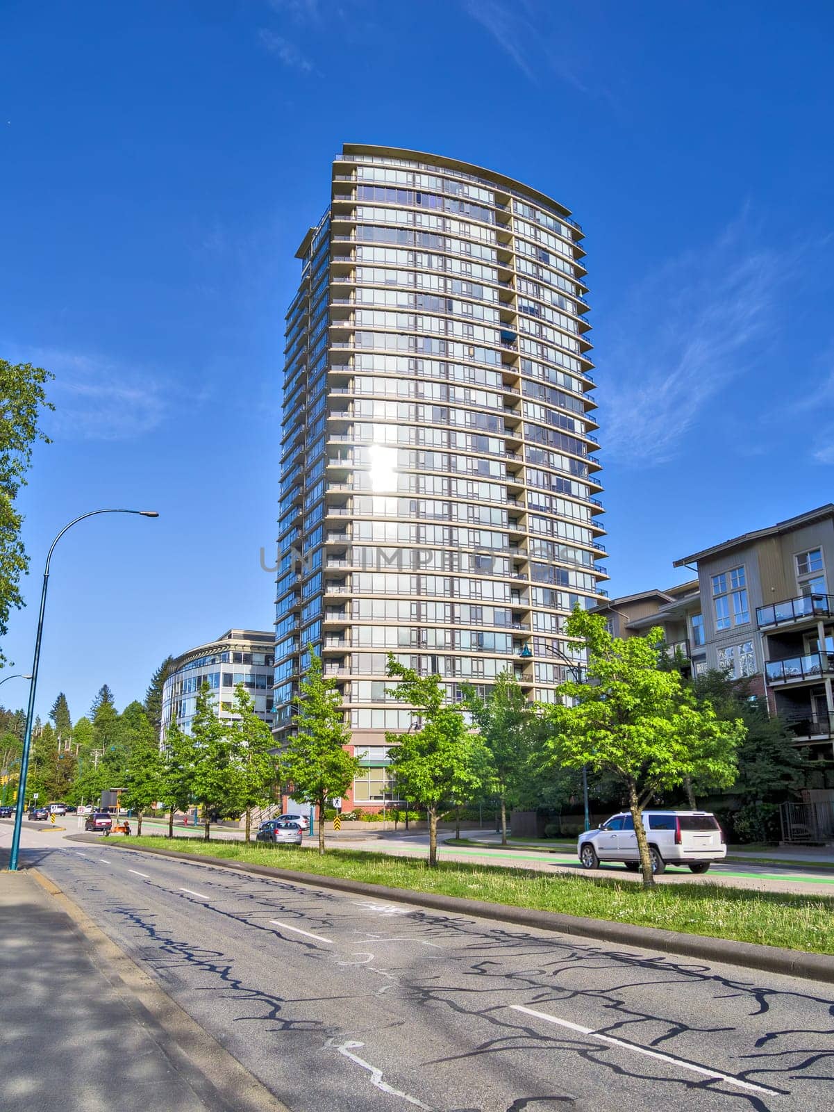 Street view with residential high-rise and low-rise buildings in Port Moody, BC.