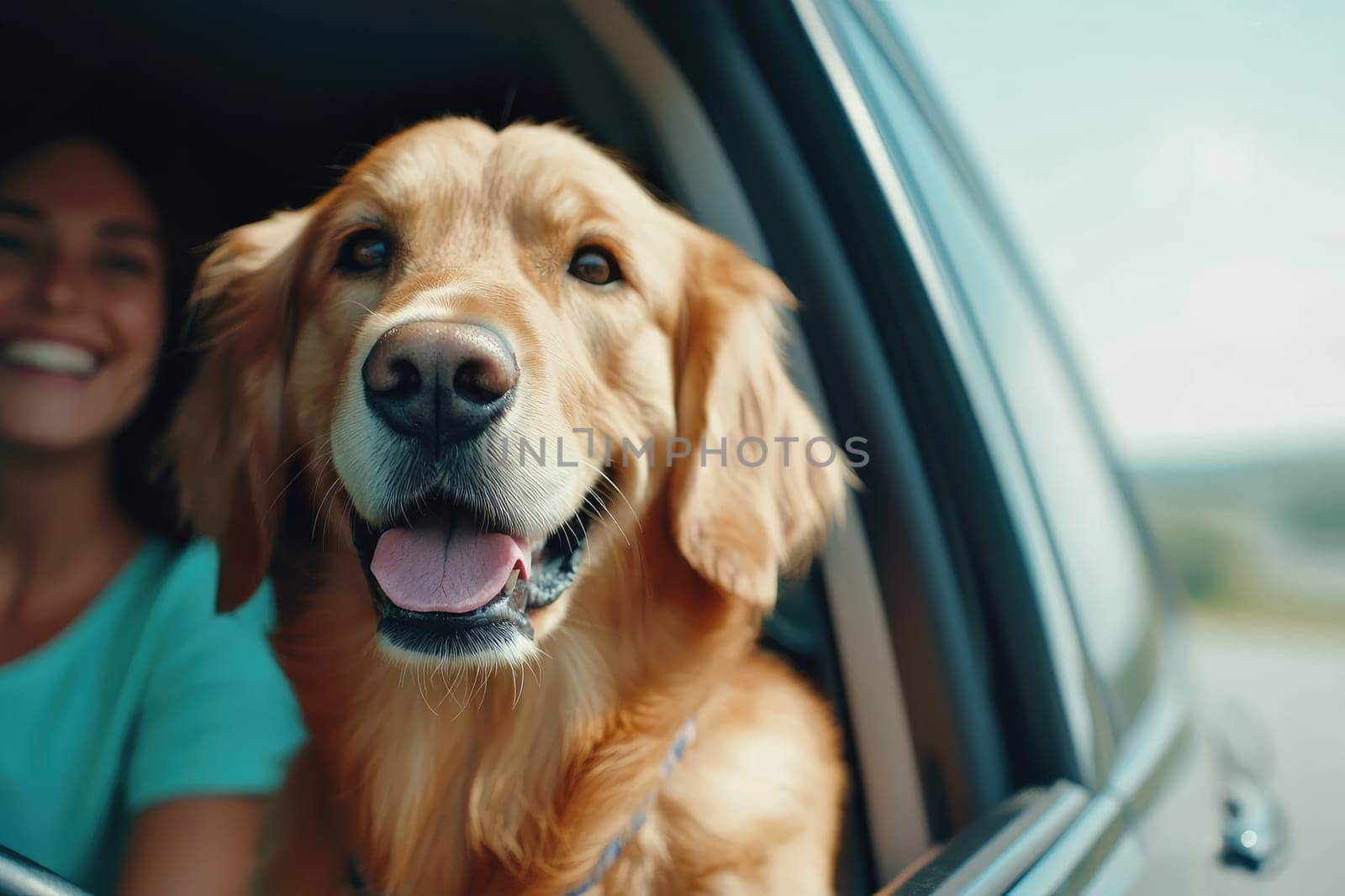 Happy golden retriever in car with smiling woman.