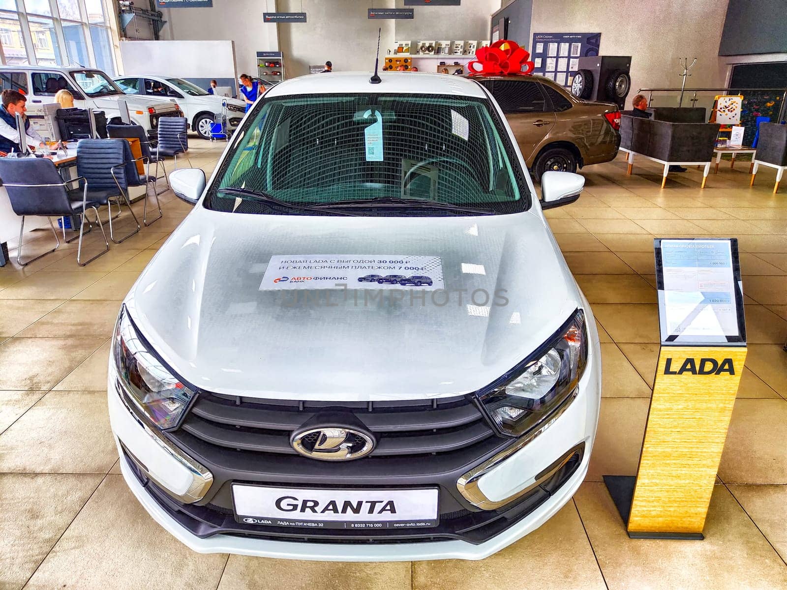 Kirov, Russia - April 27, 2023: Car in showroom of dealership Avtovaz, Lada in Russia. Russian car in big showroom