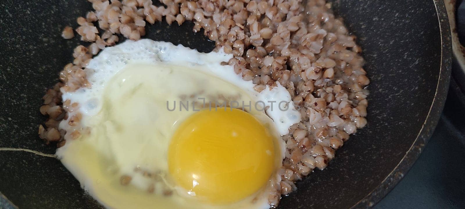scrambled eggs with buckwheat porridge, healthy food proteins carbohydrates lunch dinner breakfast. High quality photo