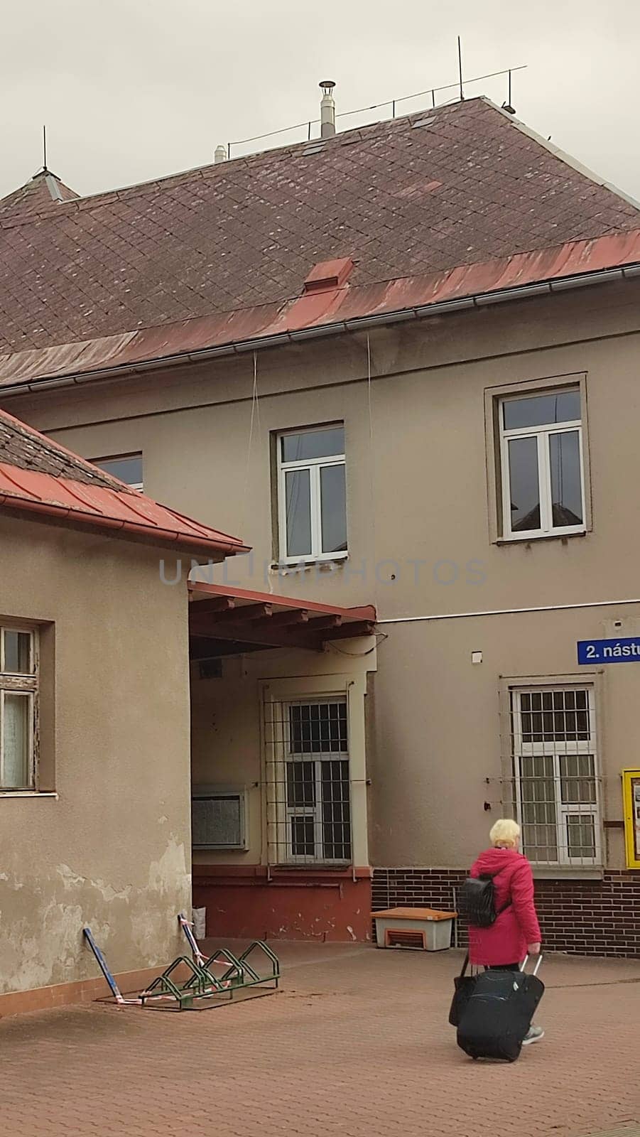 October 21 2024 Stara Paka, Czech Republic, street, railway station, building, transport, movement, sign. High quality photo