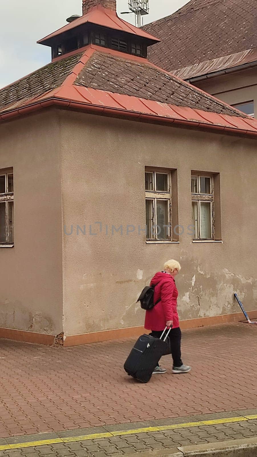 October 21 2024 Stara Paka, Czech Republic, street, railway station, building, transport, movement, sign. High quality photo