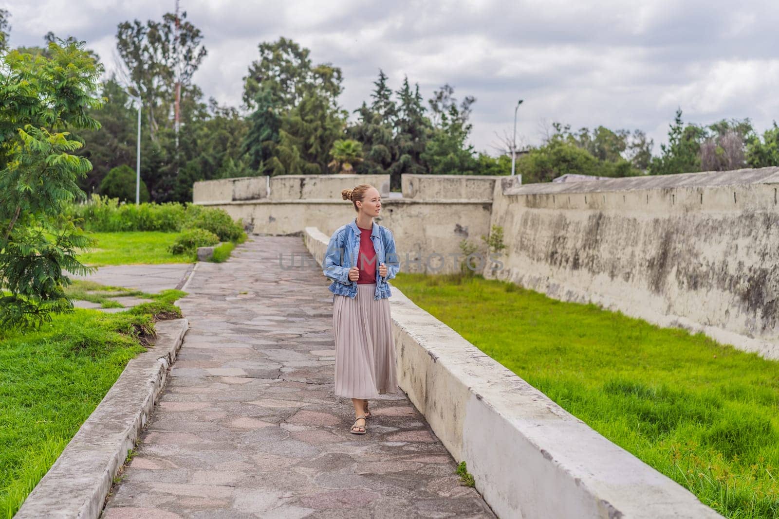 Female tourist exploring the Loreto Fort Museum in Puebla, Mexico. Cultural heritage, history, and travel exploration concept.