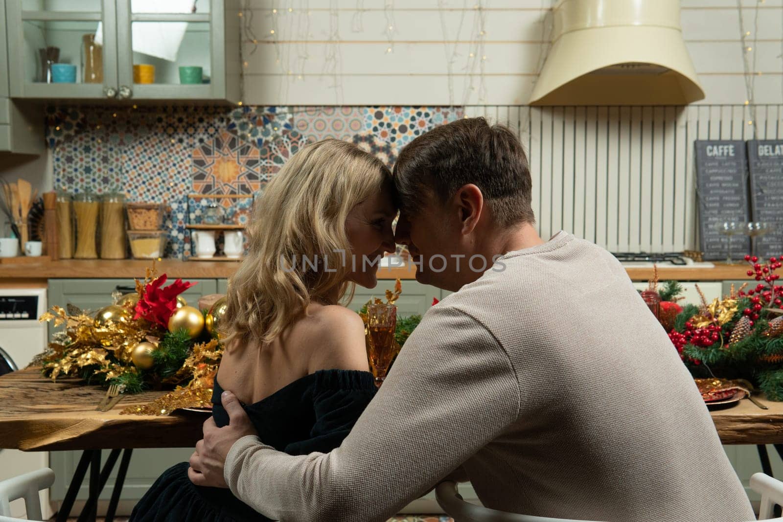 couple christmas kitchen family romantic home love husband caucasian man wife woman relationship