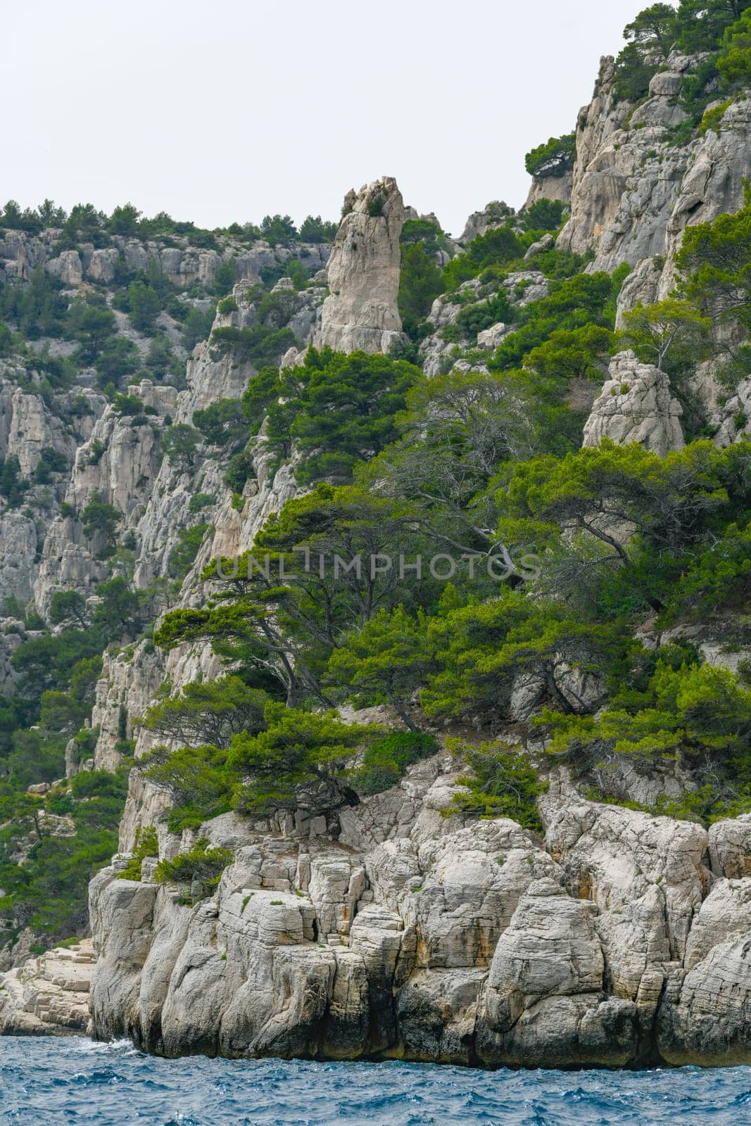 Marseille, France - June 9, 2024 : Calanque of En-Vau on the Coast of Provence, Calanques National Park seen from an excursion boat cruising, High quality 4k footage