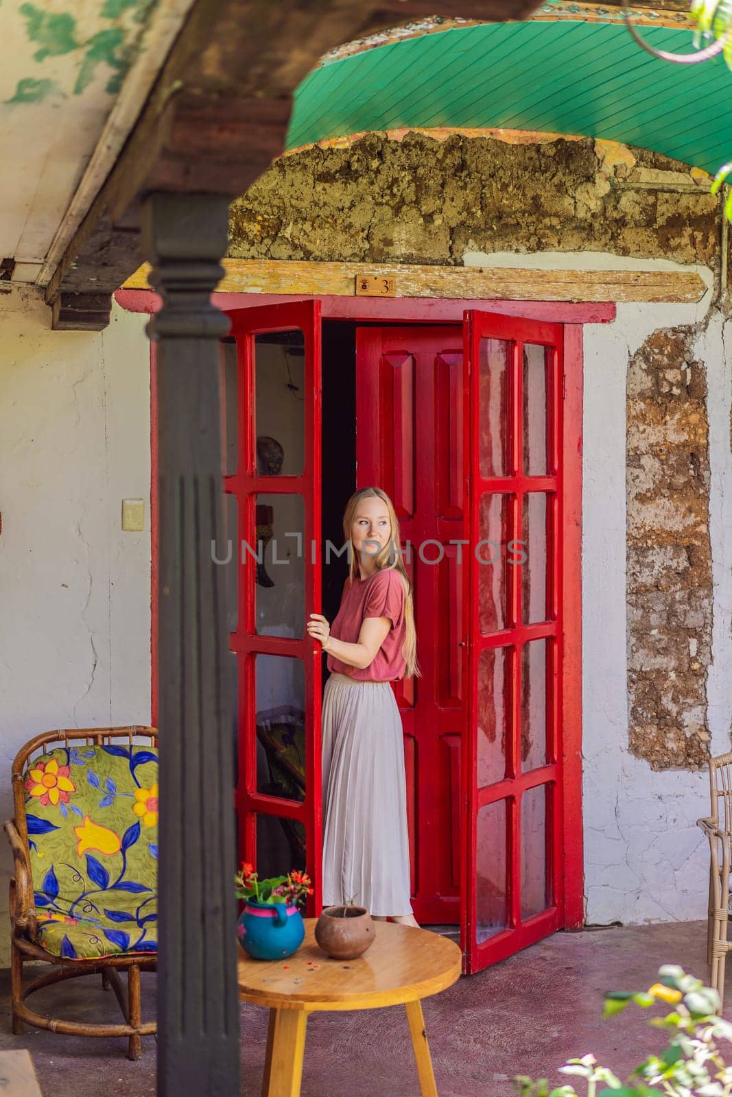 Female tourist in a colonial house in San Cristobal de las Casas, Mexico. Cultural exploration, architecture, and travel experience concept.