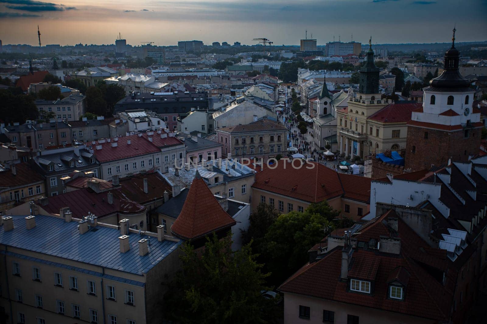 A breathtaking view of a picturesque European citys rooftops at dusk, highlighting its rich historical architecture