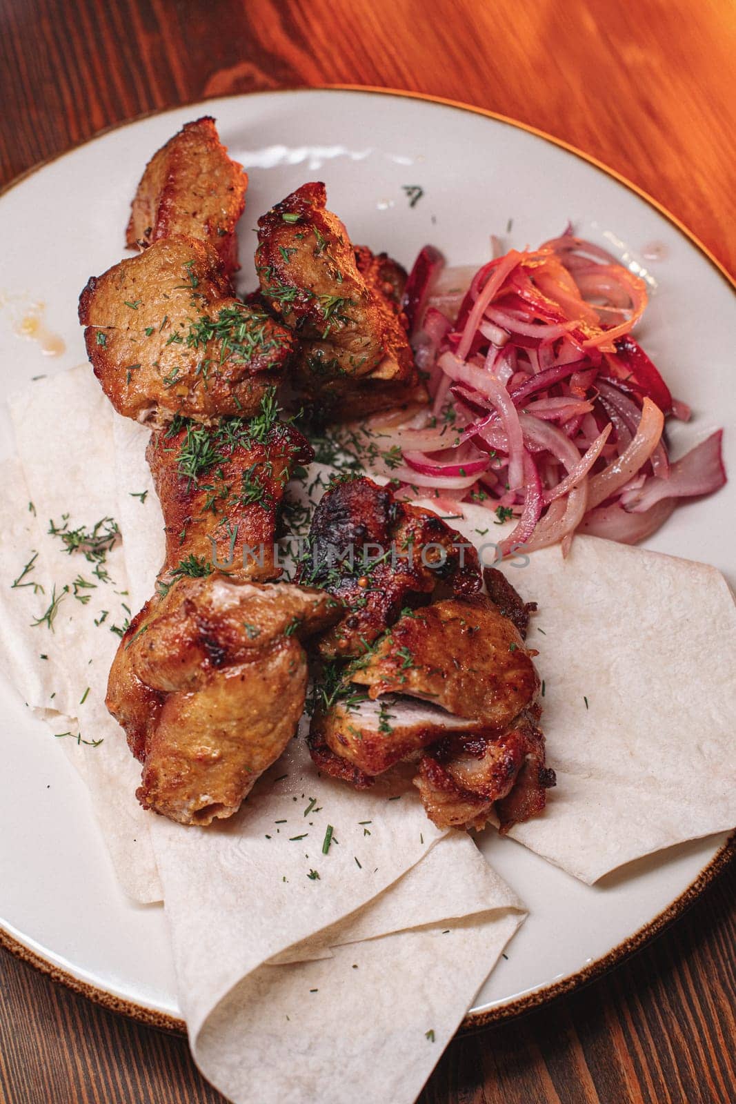 pork kebab on a plate. Juicy delicious food.
