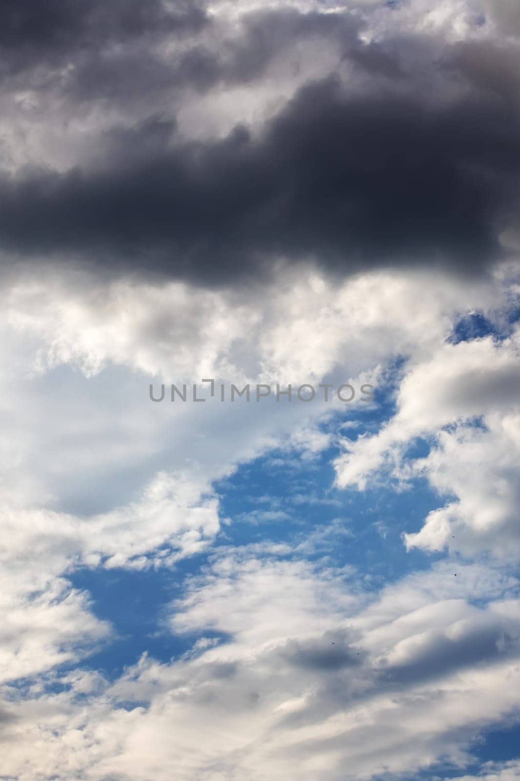 White clouds in bright blue sky close up