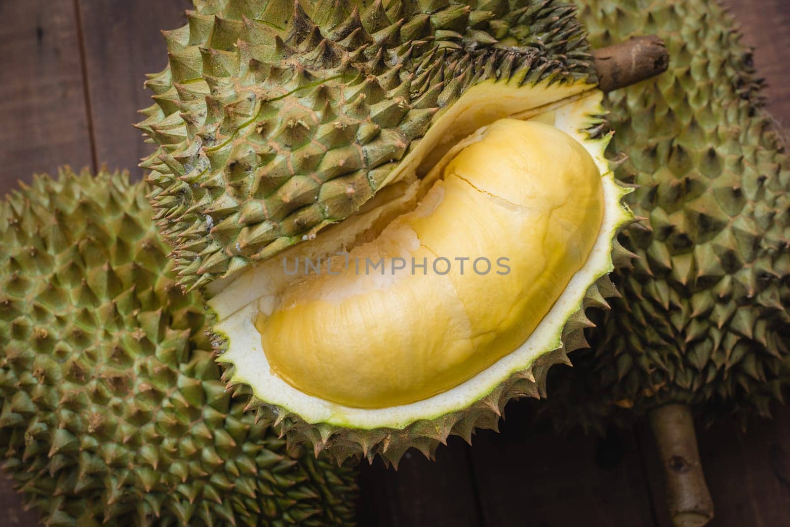 Mon Thong durian fruit on wooden plank background. Regarded by many people in southeast asia as the king of fruits.