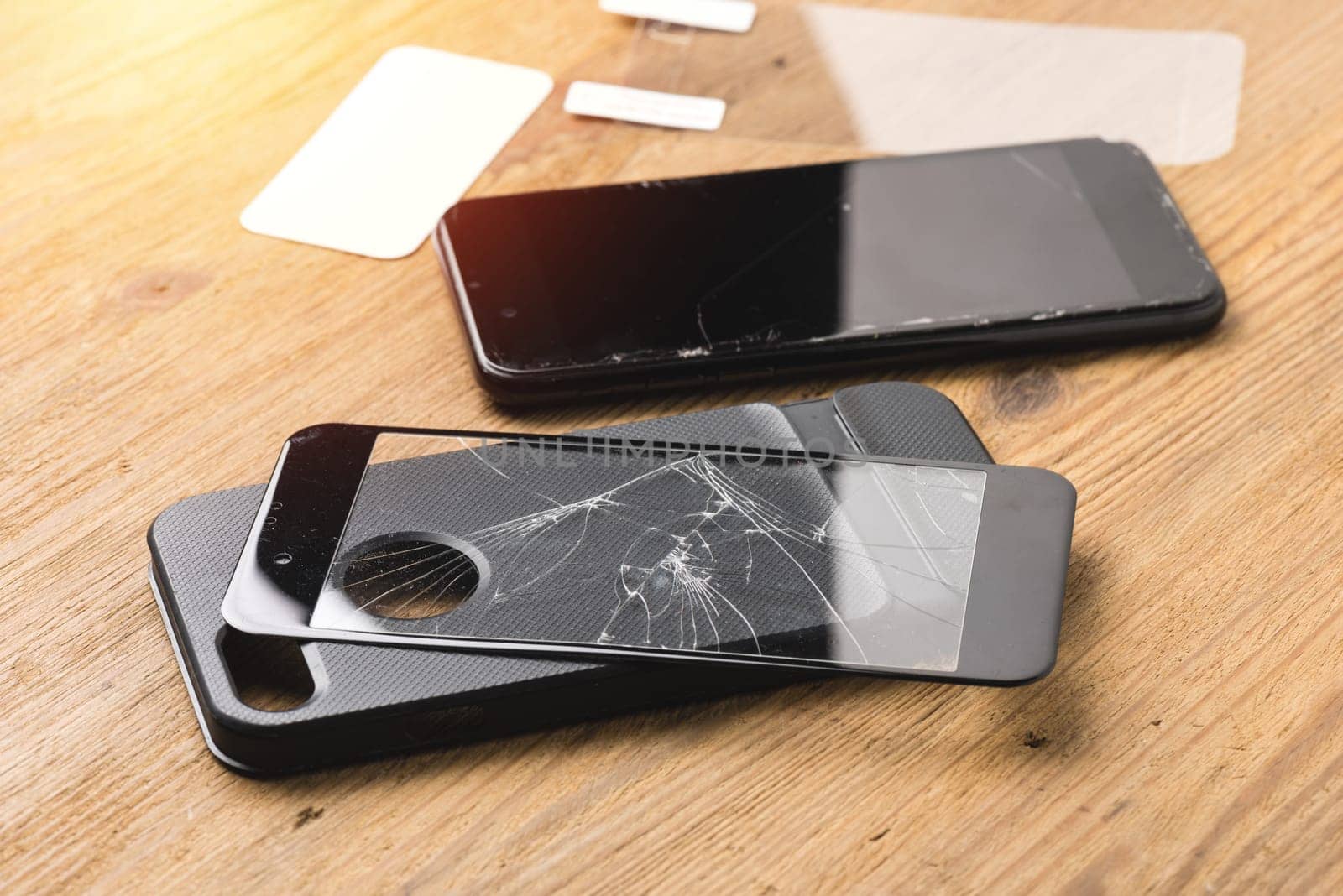 closeup broken tempered glass screen protector for smartphone.