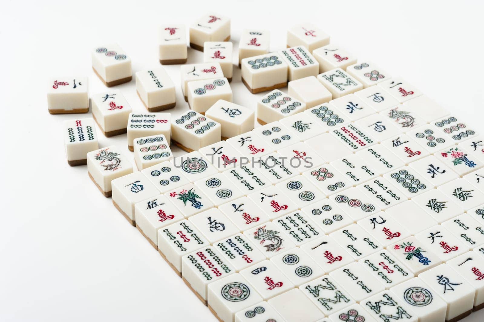 Many old mahjong tiles on white background. Mahjong is the ancient asian board game.