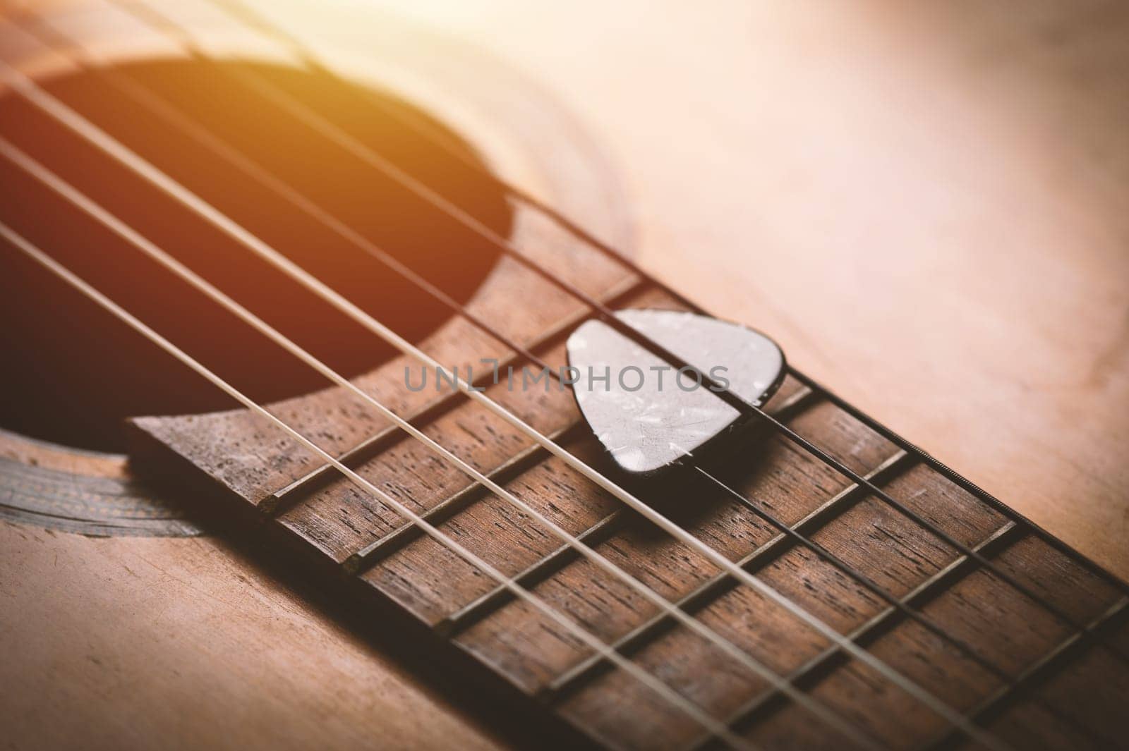 guitar pick on guitar by norgal