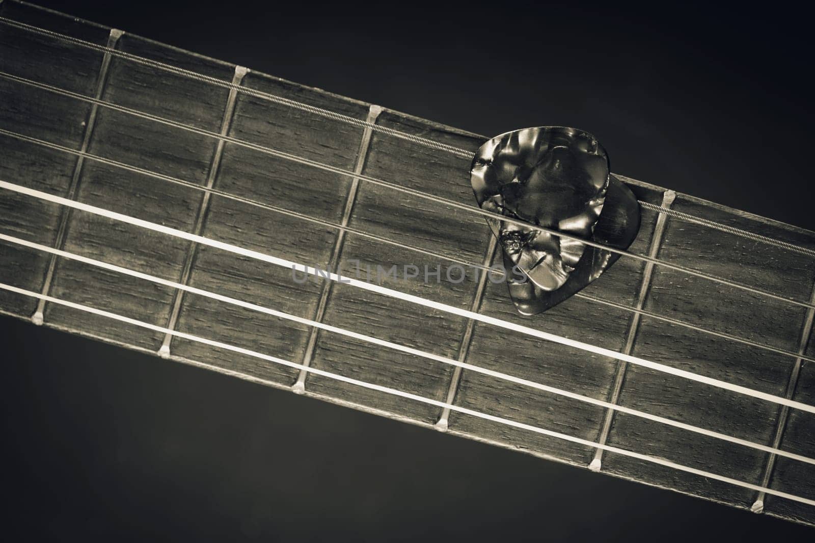 guitar pick on guitar by norgal