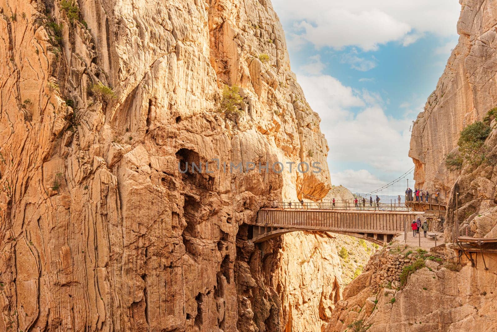 Hikers crossing the bridge of the Caminito del Rey gorge. General view