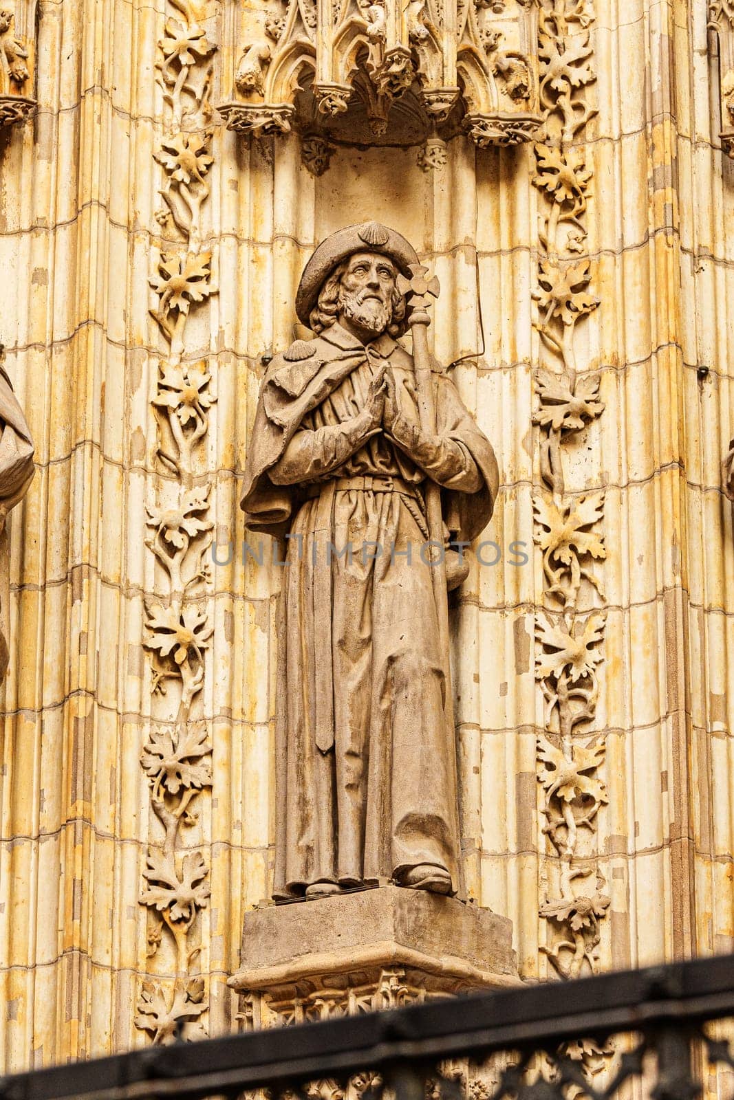 Statue of the apostle Saint James the Greater on the Assumption Gate of the Cathedral of Seville