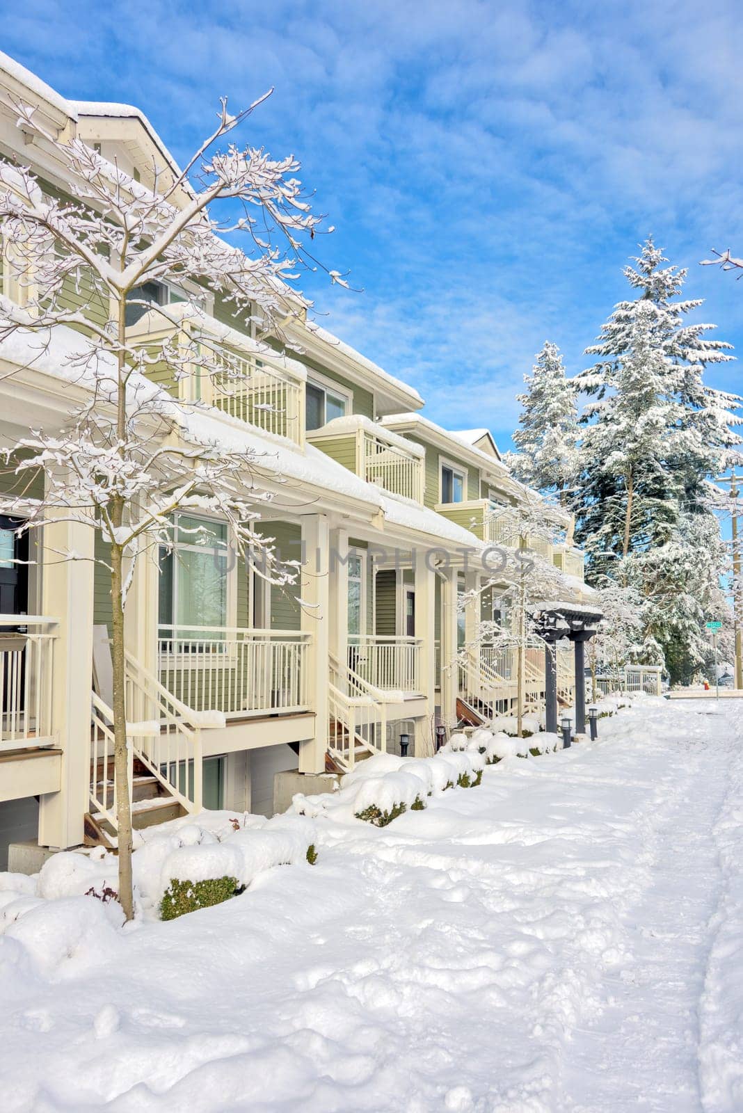 Row of residential townhouses on bright winter day in Vancouver, BC.