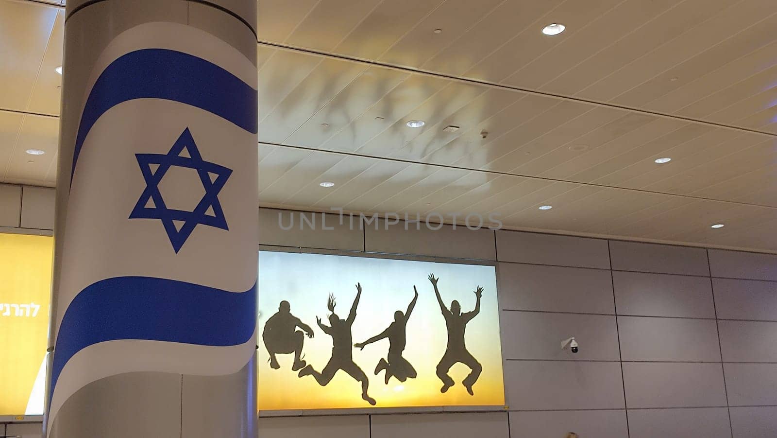 15 October 2024 Tel-Aviv Israel Ben Gurion airport Terminal 3, tourist lounge, flag Israeli, people conture High quality photo