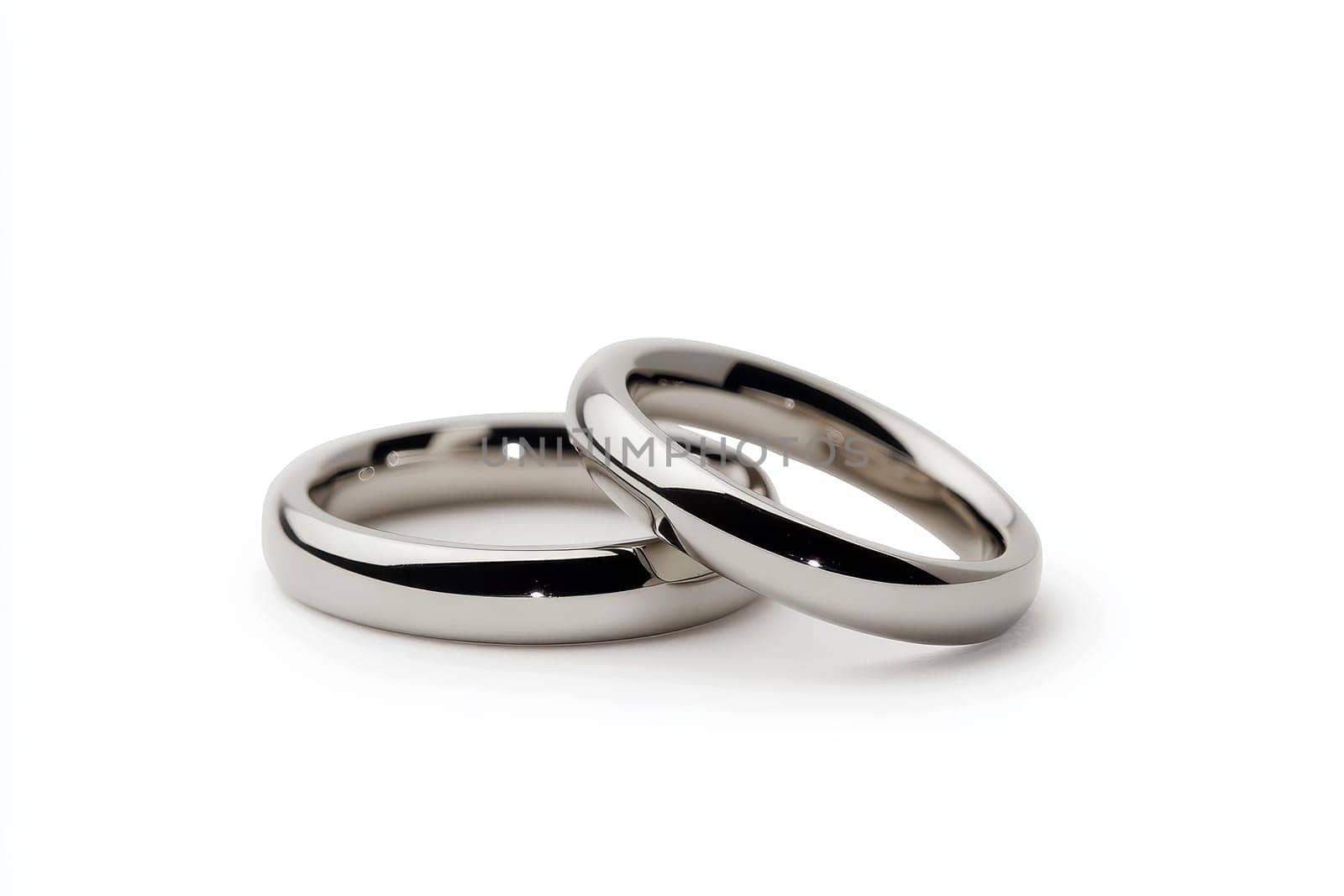 Two wedding rings cut out. Based on Generative AI.