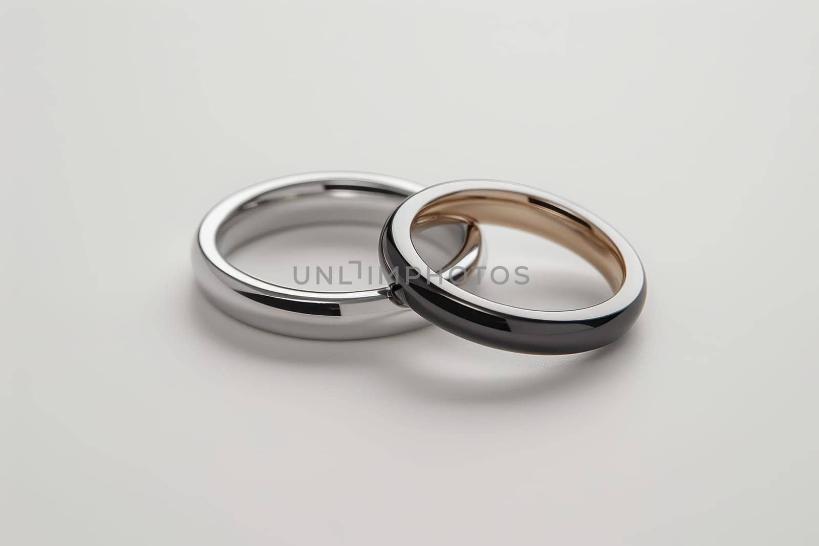 Two wedding rings cut out. Based on Generative AI.
