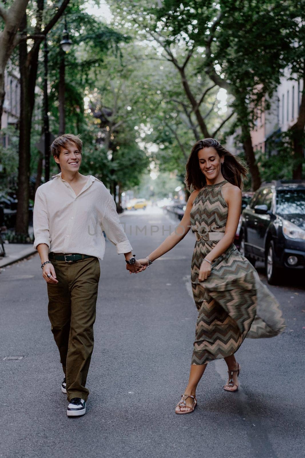 A couple enjoys a stroll through the bustling city, capturing a moment of happiness and deep connection
