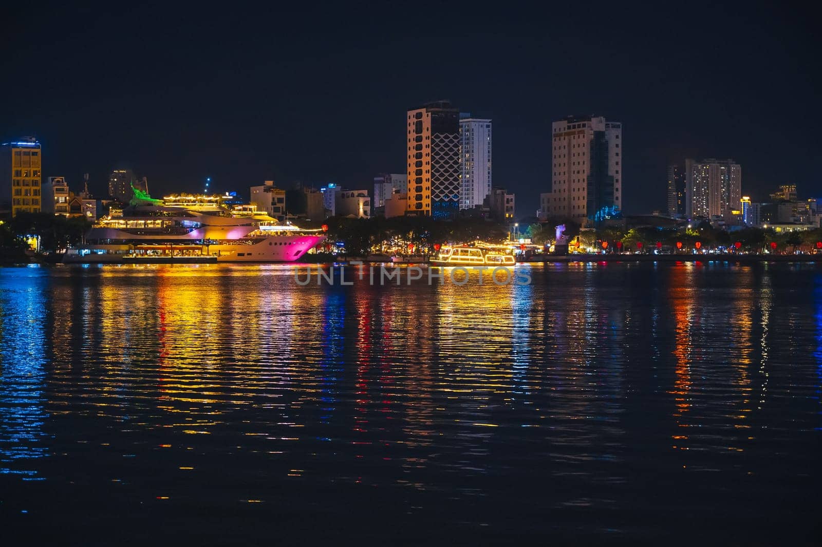 Night panorama of the Han River embankment and skyscrapers in the center of Da Nang in Vietnam at night
