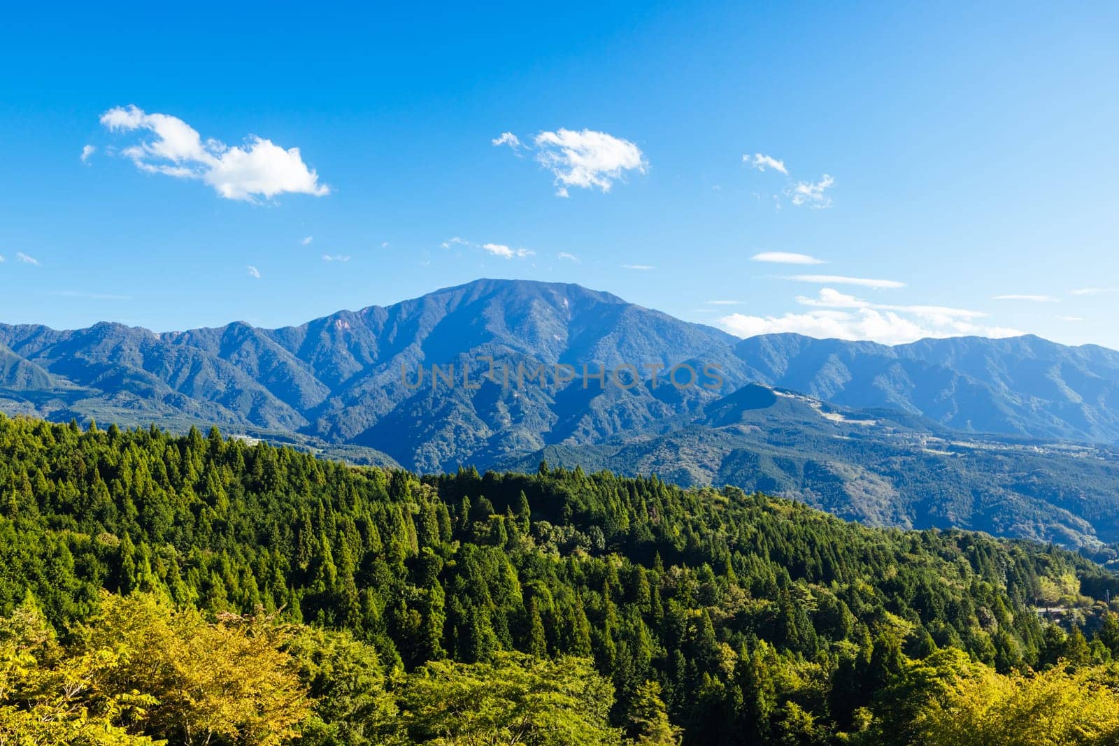 Hiking path landscape on the famous Magome-Tsumago Trail as part of the Nakasendo Way between Magome and Tsumago in Gifu Prefecture, Japan