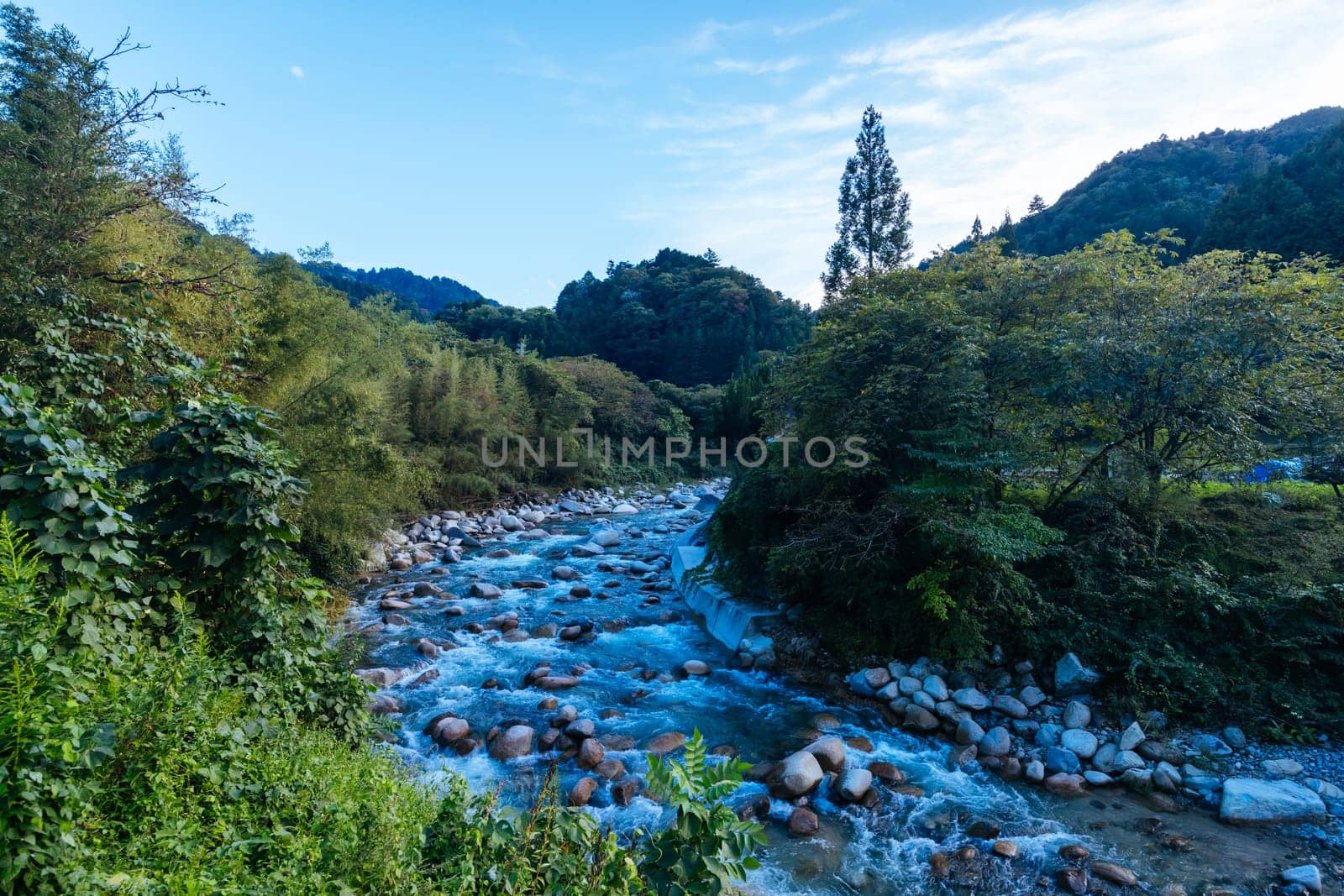 Hiking path landscape on the famous Magome-Tsumago Trail as part of the Nakasendo Way between Magome and Tsumago in Gifu Prefecture, Japan