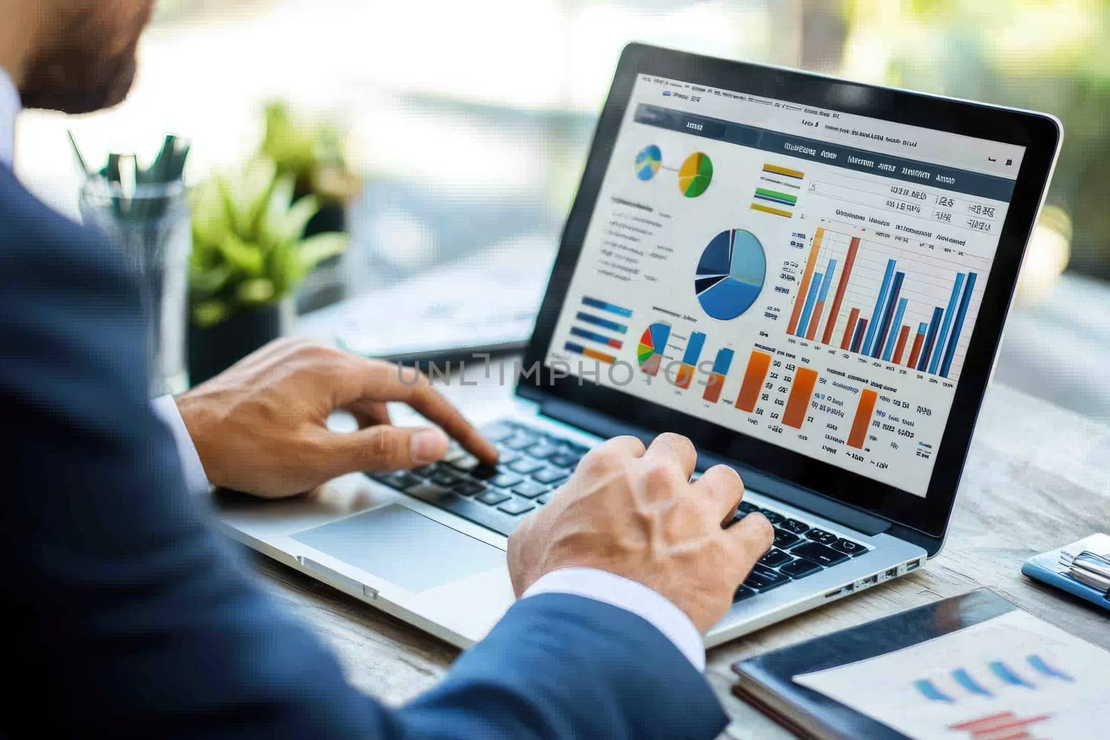 A business professional focused on analyzing visual data charts on a laptop in a bright office setting, showcasing financial insights through various graphs and diagrams.