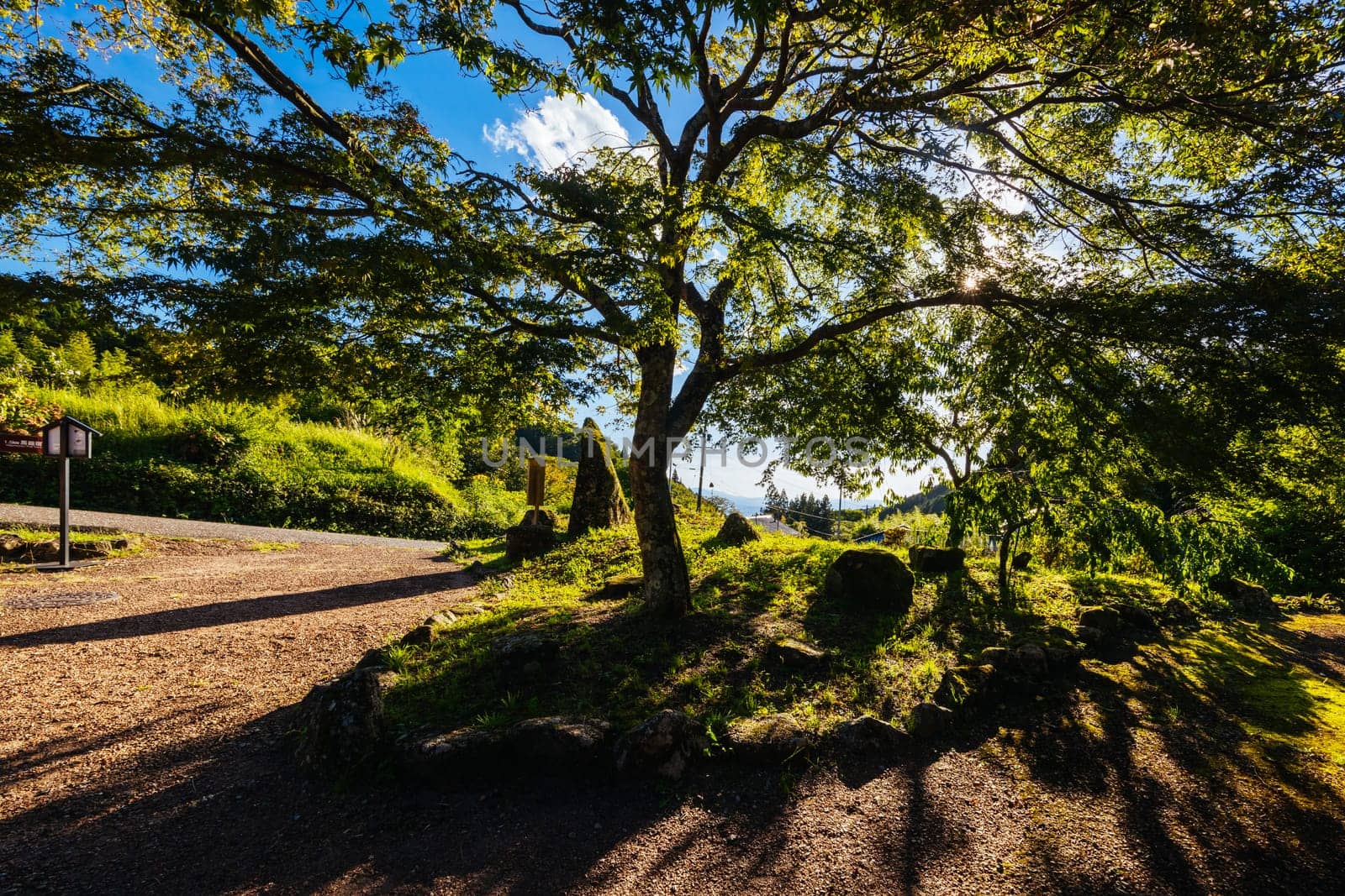 Hiking path landscape on the famous Magome-Tsumago Trail as part of the Nakasendo Way between Magome and Tsumago in Gifu Prefecture, Japan
