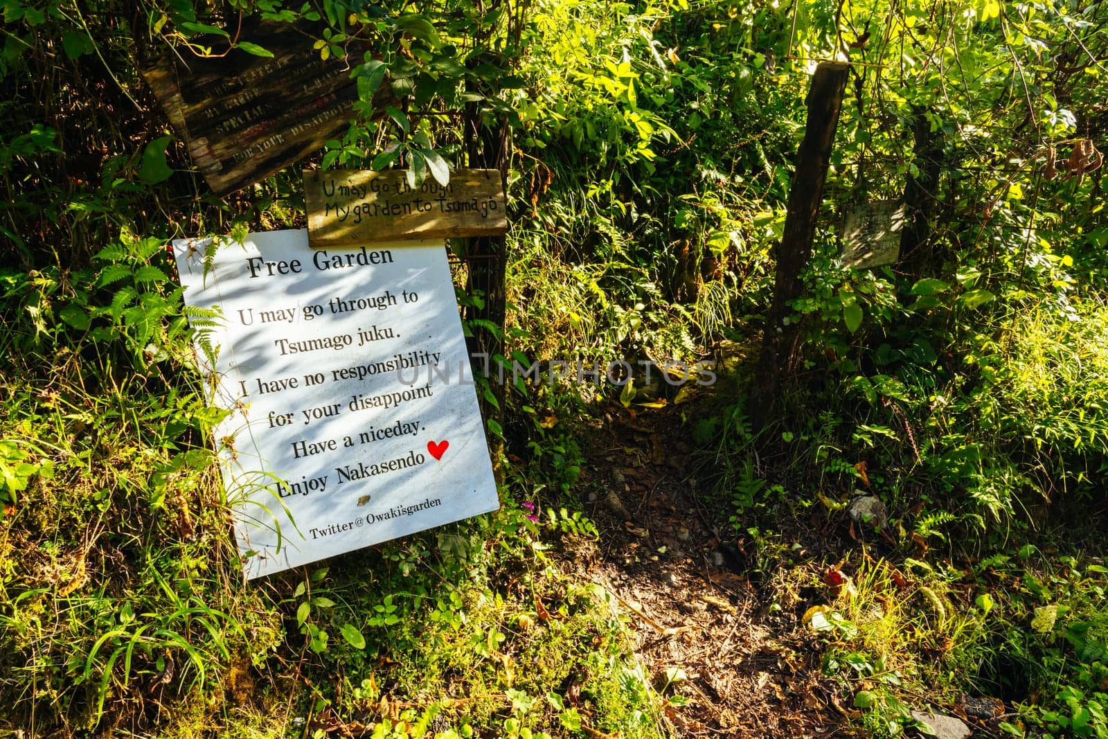 Hiking path garden on the famous Magome-Tsumago Trail as part of the Nakasendo Way between Magome and Tsumago in Gifu Prefecture, Japan